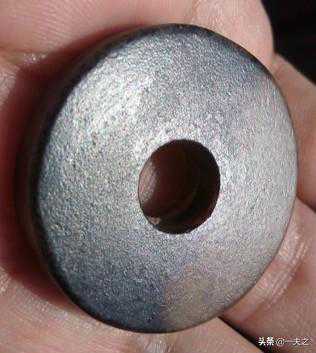 一件素玉璧的重新辨识